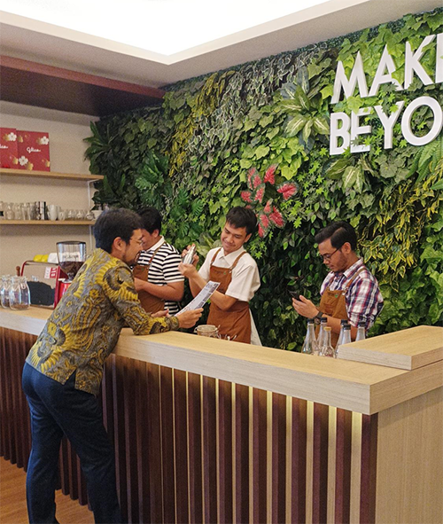 Café at the company where three baristas can work in a manner suited to their respective disabilities